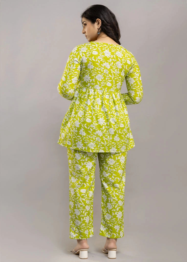Women’s green floral printed co-ord set in premium rayon, featuring a flattering silhouette with a three-quarter sleeve top and matching straight-fit pants — lightweight, breathable, and perfect for everyday versatility.