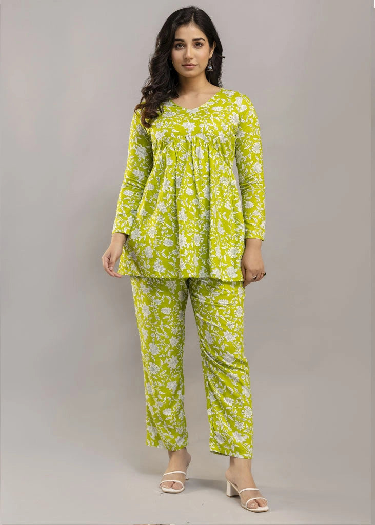 Women’s green floral printed co-ord set in premium rayon, featuring a flattering silhouette with a three-quarter sleeve top and matching straight-fit pants — lightweight, breathable, and perfect for everyday versatility.