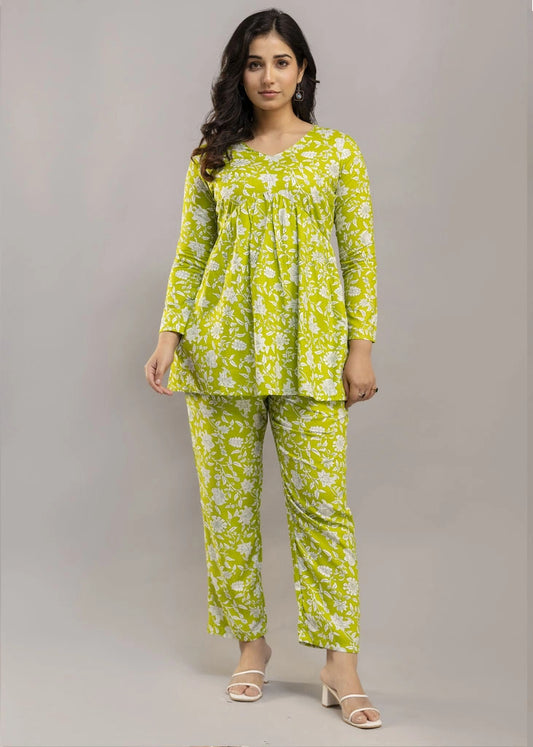 Women’s green floral printed co-ord set in premium rayon, featuring a flattering silhouette with a three-quarter sleeve top and matching straight-fit pants — lightweight, breathable, and perfect for everyday versatility.