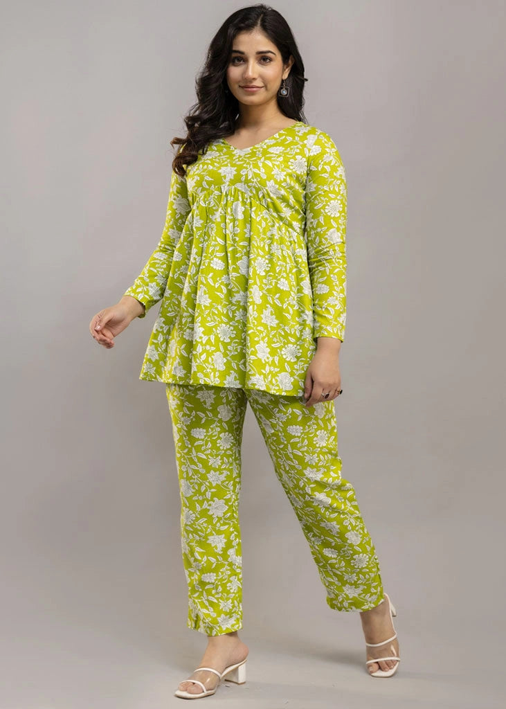 Women’s green floral printed co-ord set in premium rayon, featuring a flattering silhouette with a three-quarter sleeve top and matching straight-fit pants — lightweight, breathable, and perfect for everyday versatility.