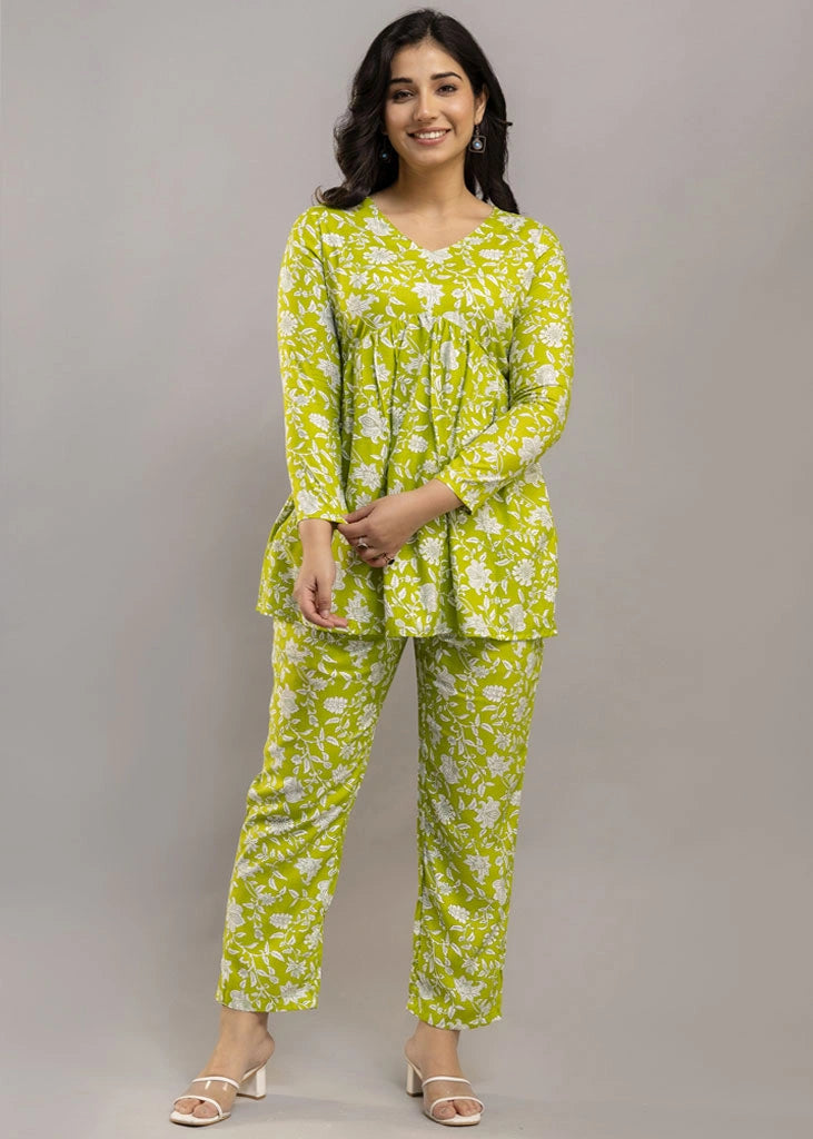 Women’s green floral printed co-ord set in premium rayon, featuring a flattering silhouette with a three-quarter sleeve top and matching straight-fit pants — lightweight, breathable, and perfect for everyday versatility.