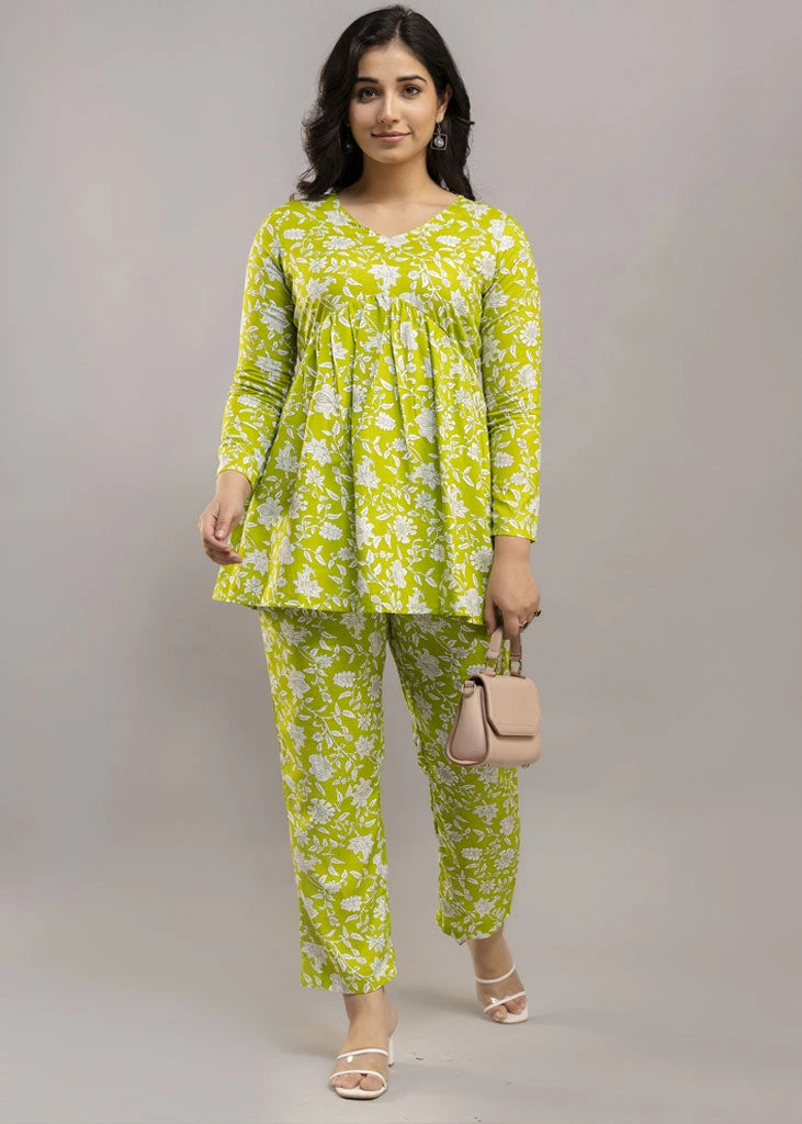 Women’s green floral printed co-ord set in premium rayon, featuring a flattering silhouette with a three-quarter sleeve top and matching straight-fit pants — lightweight, breathable, and perfect for everyday versatility.