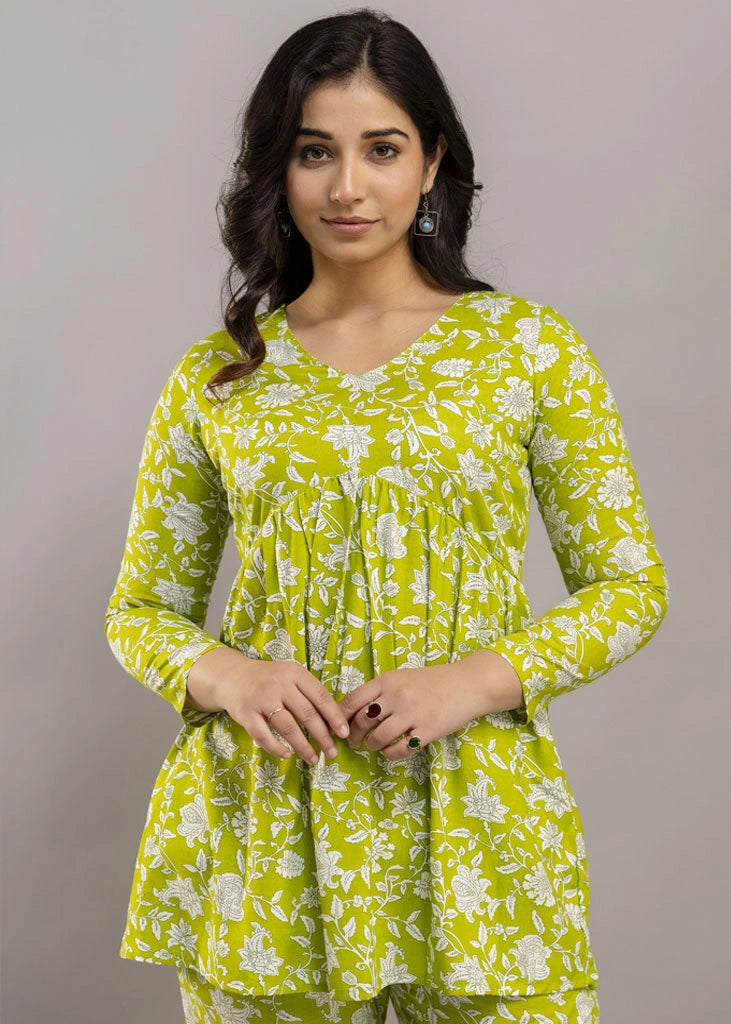 Women’s green floral printed co-ord set in premium rayon, featuring a flattering silhouette with a three-quarter sleeve top and matching straight-fit pants — lightweight, breathable, and perfect for everyday versatility.