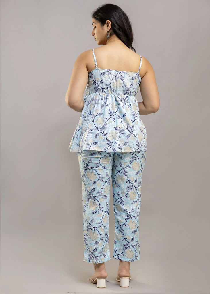 Women’s sleeveless blue floral co-ord set featuring a spaghetti strap top and matching rayon bottoms — lightweight, breathable, and stylish for sunny days and casual outings.