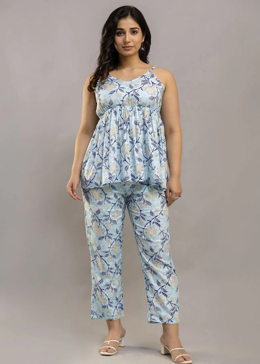 Women’s sleeveless blue floral co-ord set featuring a spaghetti strap top and matching rayon bottoms — lightweight, breathable, and stylish for sunny days and casual outings.