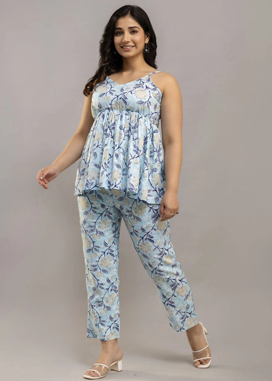 Women’s sleeveless blue floral co-ord set featuring a spaghetti strap top and matching rayon bottoms — lightweight, breathable, and stylish for sunny days and casual outings.