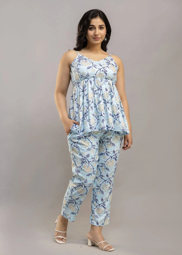 Women’s sleeveless blue floral co-ord set featuring a spaghetti strap top and matching rayon bottoms — lightweight, breathable, and stylish for sunny days and casual outings.