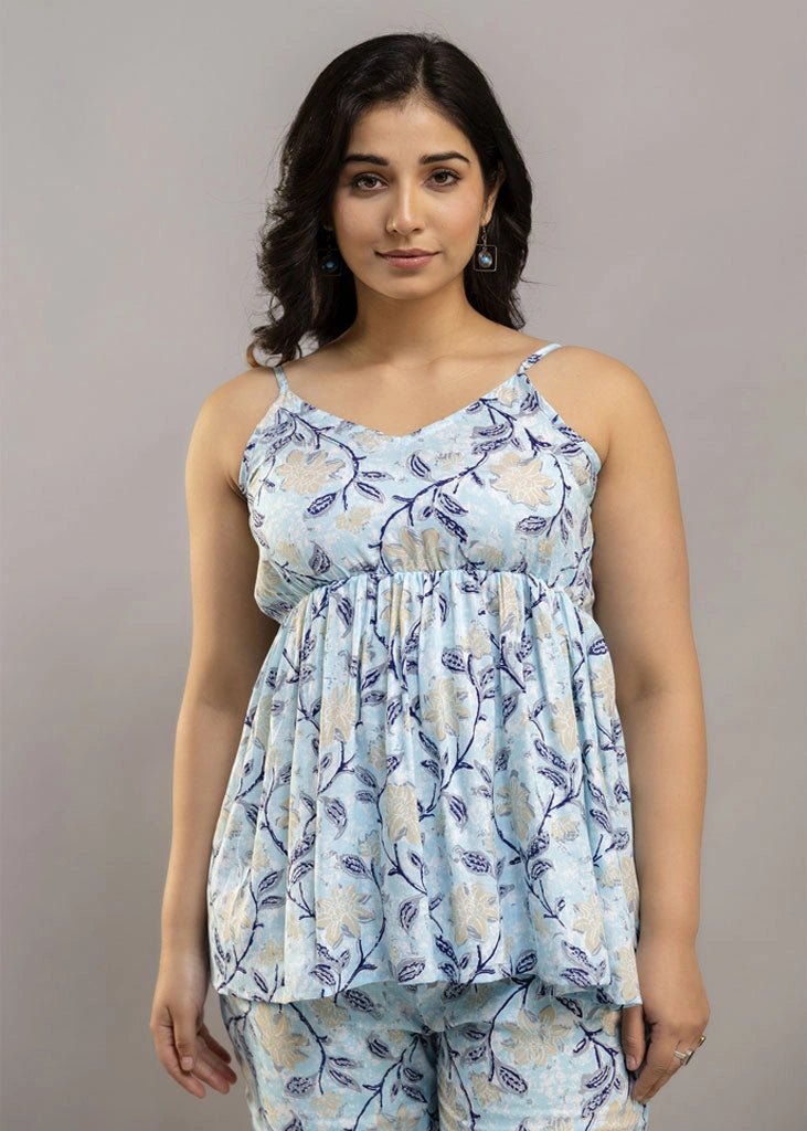 Women’s sleeveless blue floral co-ord set featuring a spaghetti strap top and matching rayon bottoms — lightweight, breathable, and stylish for sunny days and casual outings.
