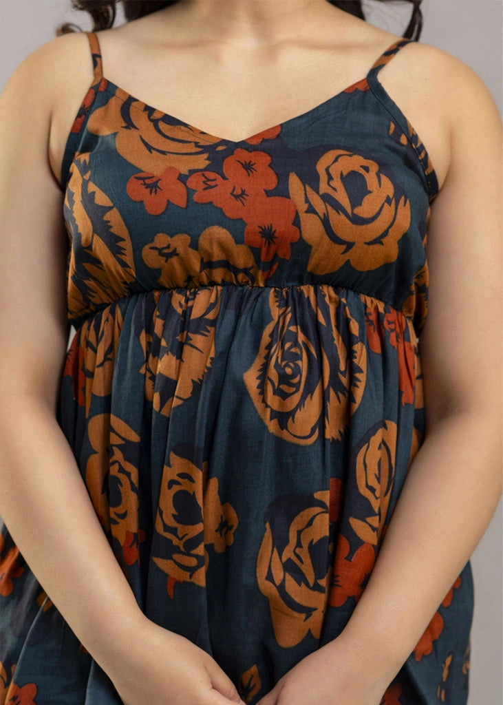 Women’s rust and teal floral co-ord set with a sleeveless spaghetti strap top and matching premium rayon pants — lightweight, stylish, and perfect for warm-weather wear.