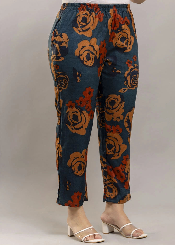 Women’s rust and teal floral co-ord set with a sleeveless spaghetti strap top and matching premium rayon pants — lightweight, stylish, and perfect for warm-weather wear.
