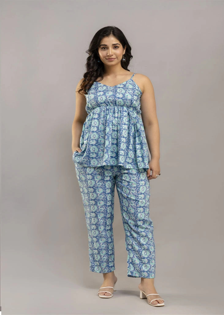 Women’s blue floral co-ord set with sleeveless spaghetti strap top and matching rayon pants — lightweight, breezy, and perfect for summer style and all-day comfort.