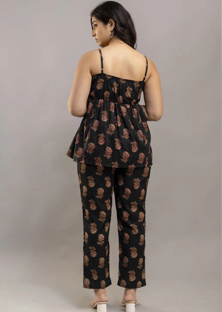 Women’s aqua floral co-ord set featuring a sleeveless spaghetti strap top and matching rayon pants — soft, breathable, and ideal for sunny days and effortless charm.