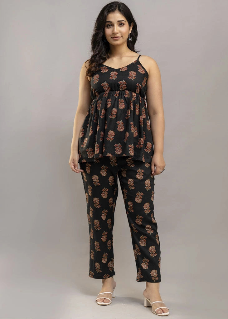Women’s aqua floral co-ord set featuring a sleeveless spaghetti strap top and matching rayon pants — soft, breathable, and ideal for sunny days and effortless charm.
