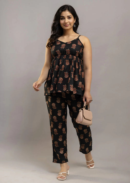 Women’s aqua floral co-ord set featuring a sleeveless spaghetti strap top and matching rayon pants — soft, breathable, and ideal for sunny days and effortless charm.