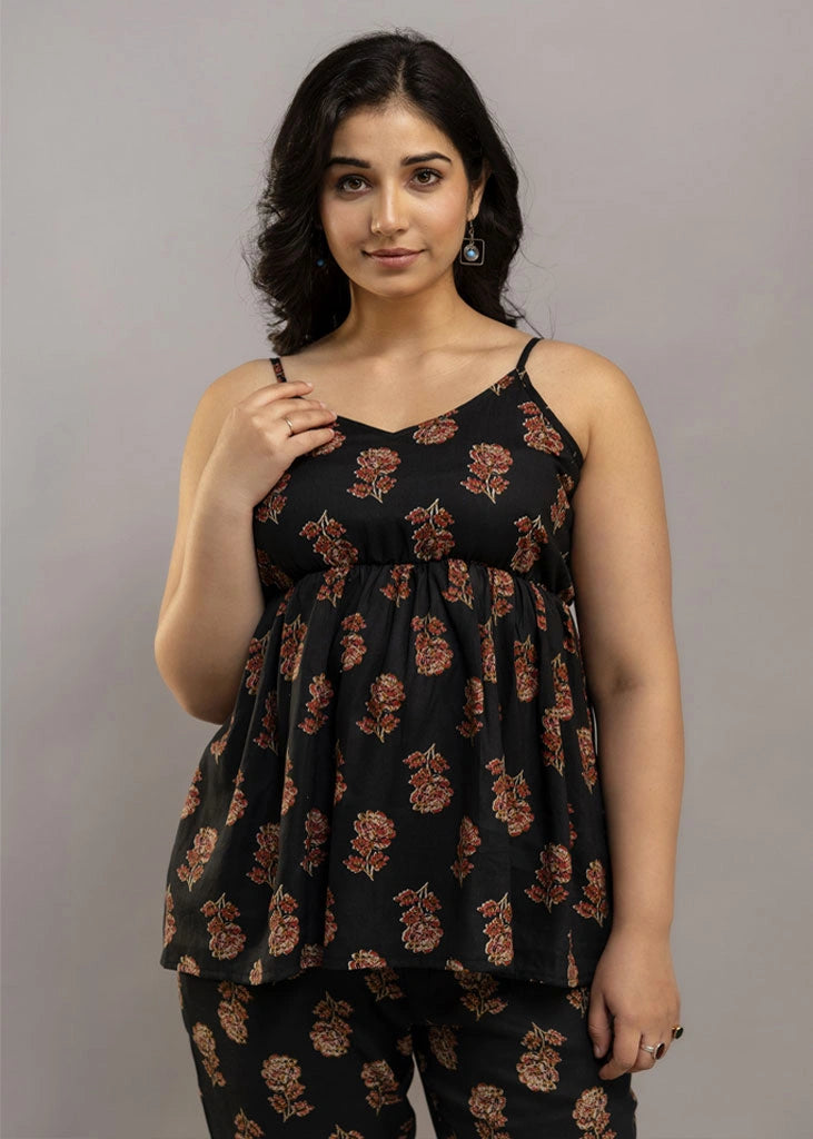 Women’s aqua floral co-ord set featuring a sleeveless spaghetti strap top and matching rayon pants — soft, breathable, and ideal for sunny days and effortless charm.