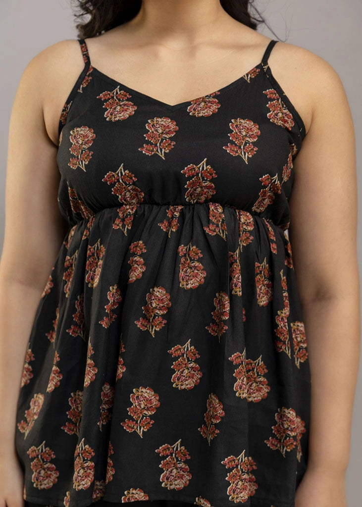 Women’s aqua floral co-ord set featuring a sleeveless spaghetti strap top and matching rayon pants — soft, breathable, and ideal for sunny days and effortless charm.