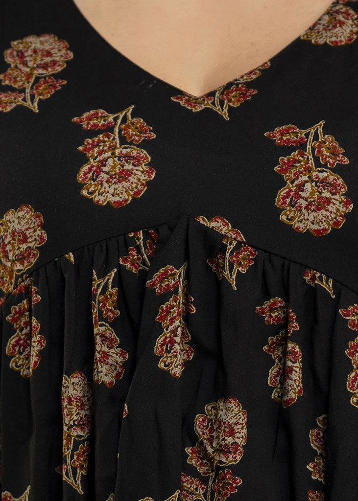 Women’s black co-ord set in soft rayon, featuring rustic floral prints, a full-sleeve flared top with a relaxed silhouette, and matching straight-fit pants — combining effortless elegance with everyday comfort.