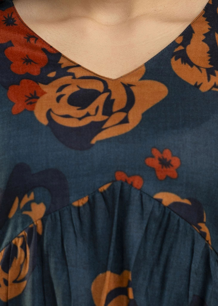 Women’s teal and rust floral printed co-ord set in premium rayon, featuring a flowy gathered top with relaxed flared full sleeves and matching straight-fit pants — a soft, breathable outfit that blends bold style with everyday comfort.