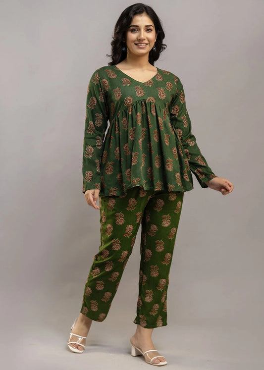 Women’s forest green floral printed co-ord set in premium rayon, featuring a gathered empire-line top with full sleeves and straight-fit pants with pockets — blending natural charm with everyday comfort.