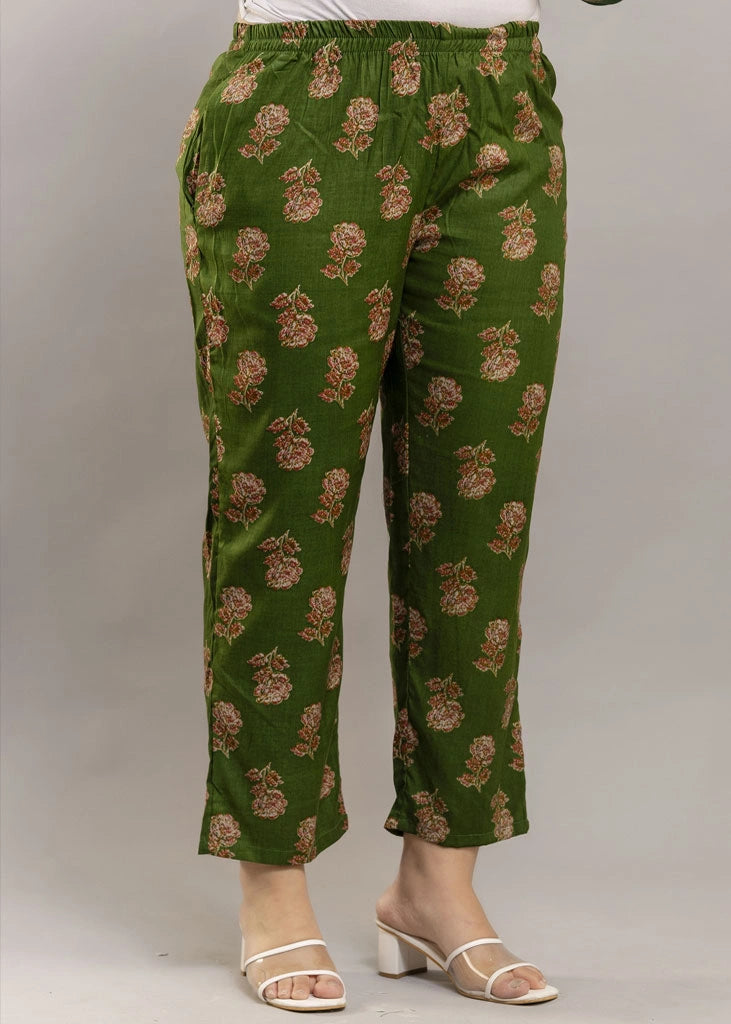 Women’s forest green floral printed co-ord set in premium rayon, featuring a gathered empire-line top with full sleeves and straight-fit pants with pockets — blending natural charm with everyday comfort.