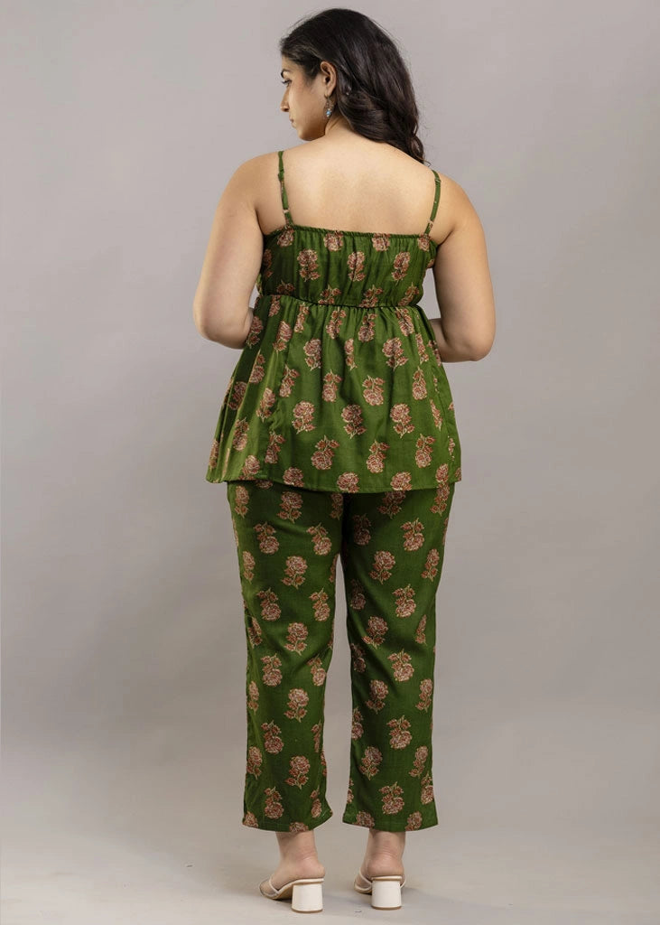 Women’s pistachio green floral co-ord set featuring a sleeveless spaghetti strap top and matching premium rayon pants — a breezy, stylish pick for summer outings and casual wear.