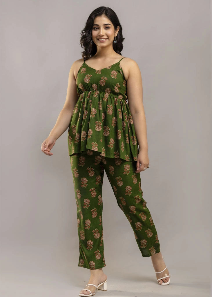 Women’s pistachio green floral co-ord set featuring a sleeveless spaghetti strap top and matching premium rayon pants — a breezy, stylish pick for summer outings and casual wear.