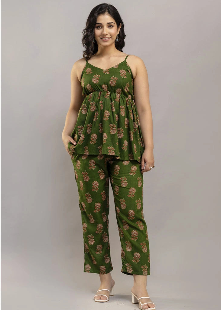 Women’s pistachio green floral co-ord set featuring a sleeveless spaghetti strap top and matching premium rayon pants — a breezy, stylish pick for summer outings and casual wear.