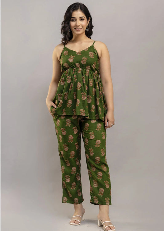 Women’s pistachio green floral co-ord set featuring a sleeveless spaghetti strap top and matching premium rayon pants — a breezy, stylish pick for summer outings and casual wear.