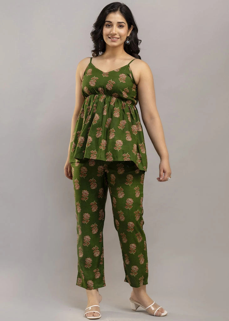 Women’s pistachio green floral co-ord set featuring a sleeveless spaghetti strap top and matching premium rayon pants — a breezy, stylish pick for summer outings and casual wear.