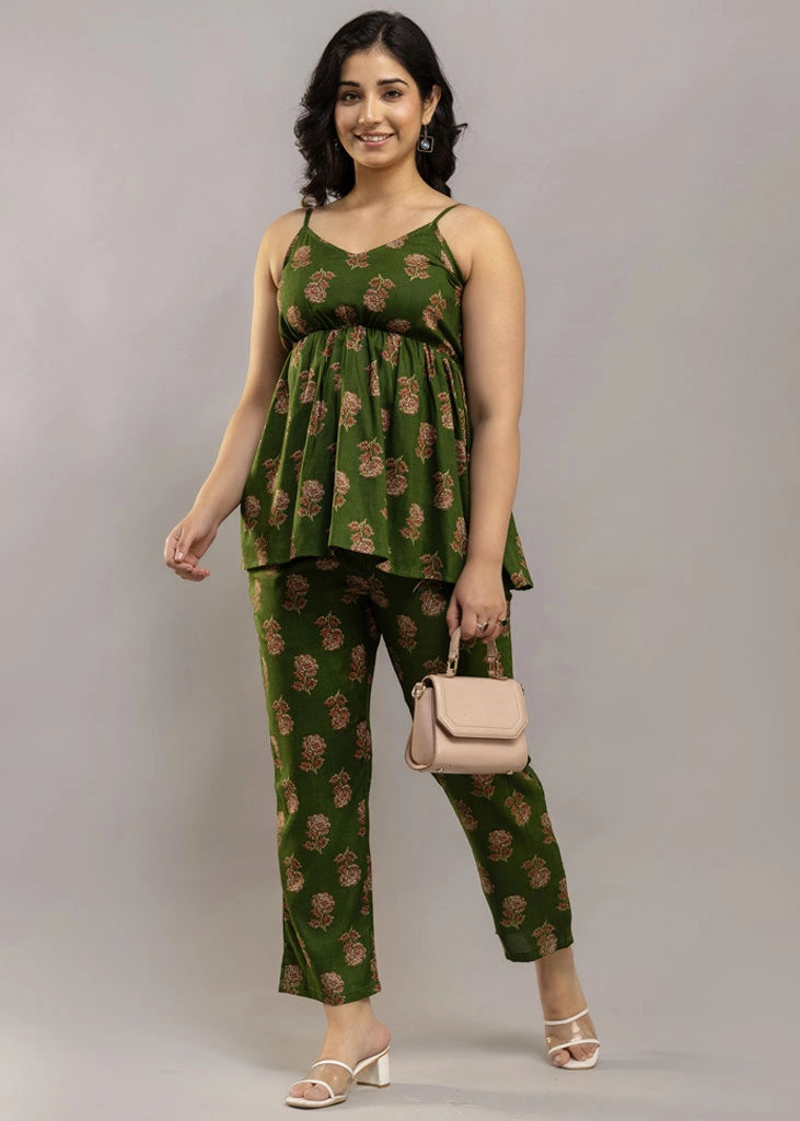 Women’s pistachio green floral co-ord set featuring a sleeveless spaghetti strap top and matching premium rayon pants — a breezy, stylish pick for summer outings and casual wear.