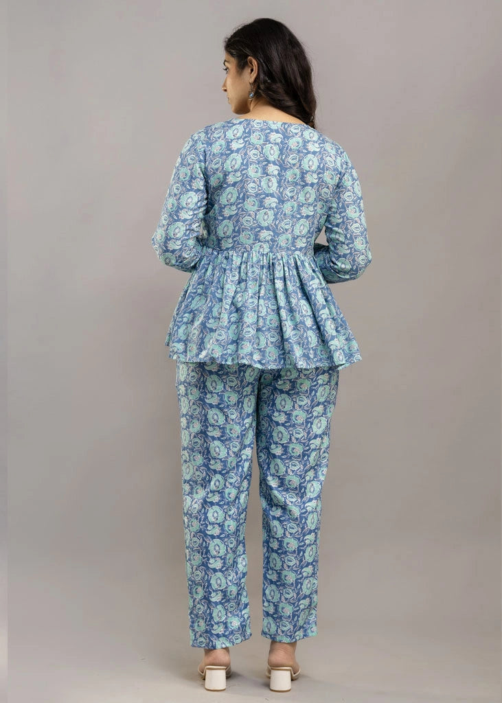 Women’s blue floral printed co-ord set in soft rayon, featuring a relaxed-fit gathered top with full sleeves and matching elasticated pants — lightweight and breezy for all-day comfort.