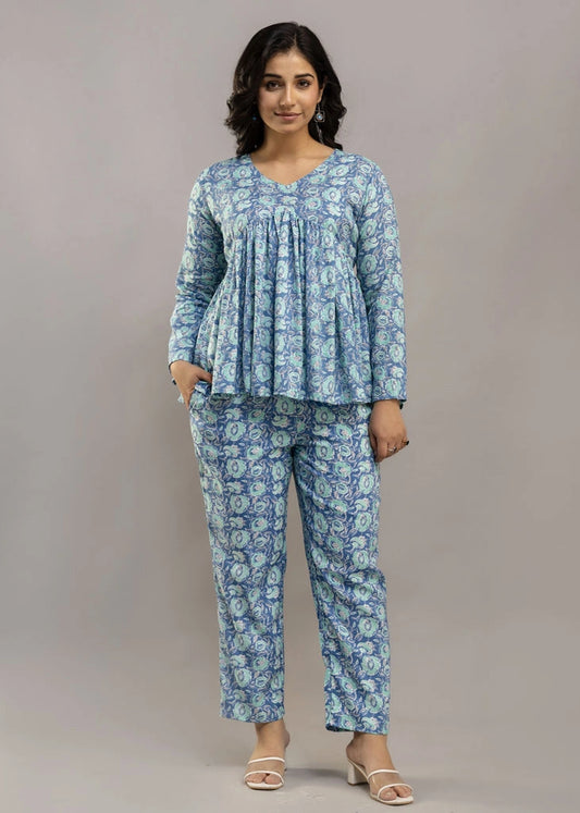 Women’s blue floral printed co-ord set in soft rayon, featuring a relaxed-fit gathered top with full sleeves and matching elasticated pants — lightweight and breezy for all-day comfort.