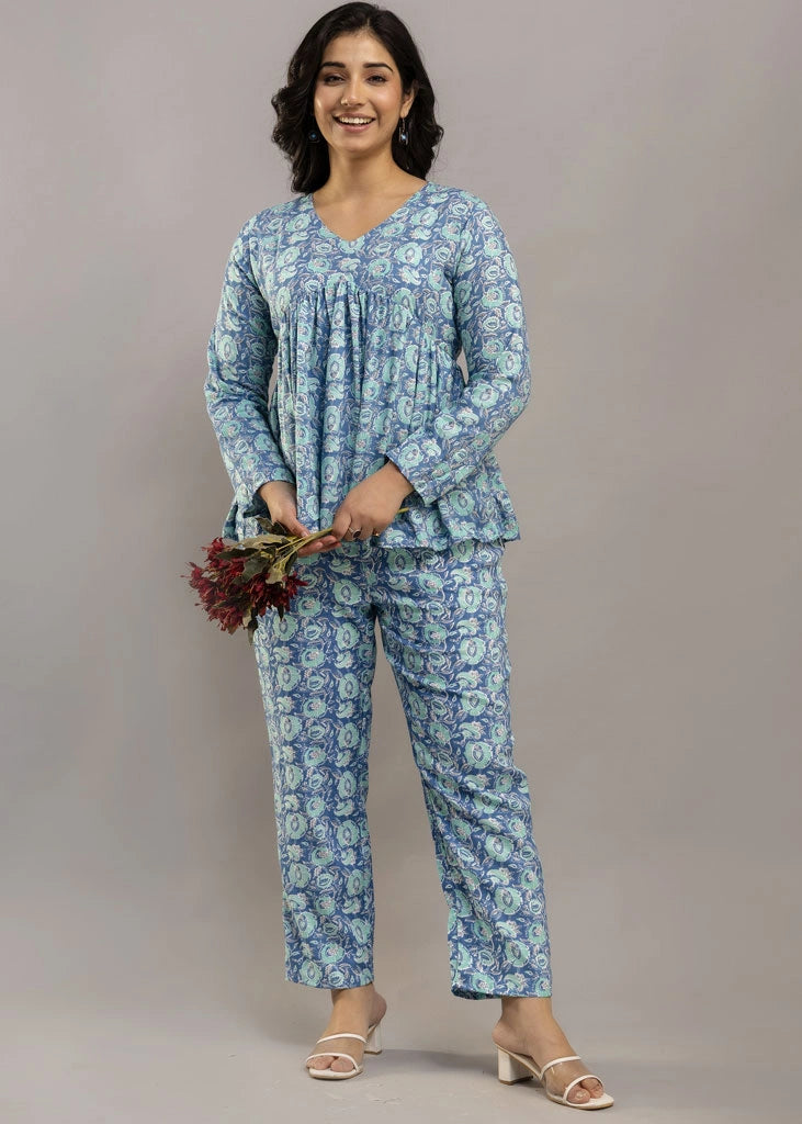 Women’s blue floral printed co-ord set in soft rayon, featuring a relaxed-fit gathered top with full sleeves and matching elasticated pants — lightweight and breezy for all-day comfort.