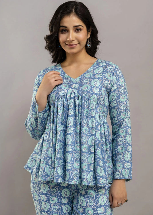 Women’s blue floral printed co-ord set in soft rayon, featuring a relaxed-fit gathered top with full sleeves and matching elasticated pants — lightweight and breezy for all-day comfort.
