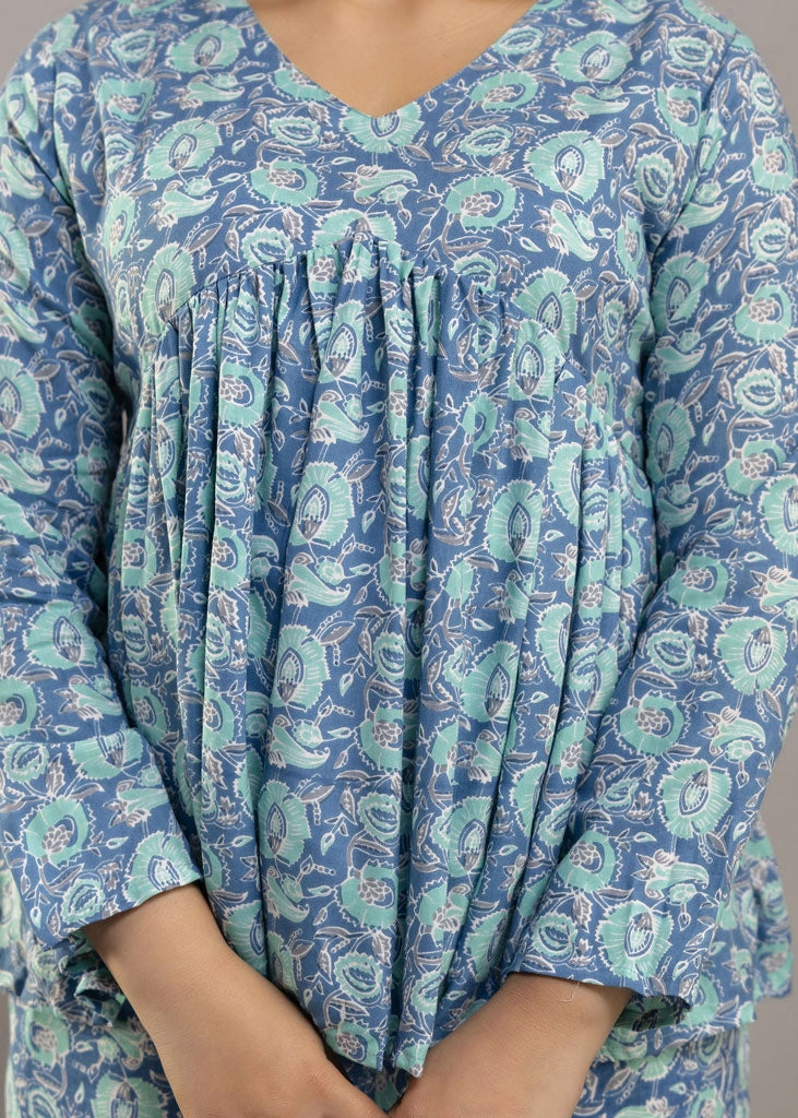Women’s blue floral printed co-ord set in soft rayon, featuring a relaxed-fit gathered top with full sleeves and matching elasticated pants — lightweight and breezy for all-day comfort.
