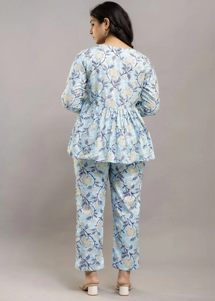 Women’s pastel blue leafy print co-ord set in soft rayon, featuring a gathered flowy top with a gentle V-neckline and full sleeves, paired with relaxed-fit pants with pockets — a blend of comfort and elegance for everyday wear.