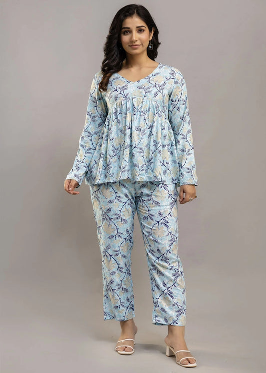 Women’s pastel blue leafy print co-ord set in soft rayon, featuring a gathered flowy top with a gentle V-neckline and full sleeves, paired with relaxed-fit pants with pockets — a blend of comfort and elegance for everyday wear.