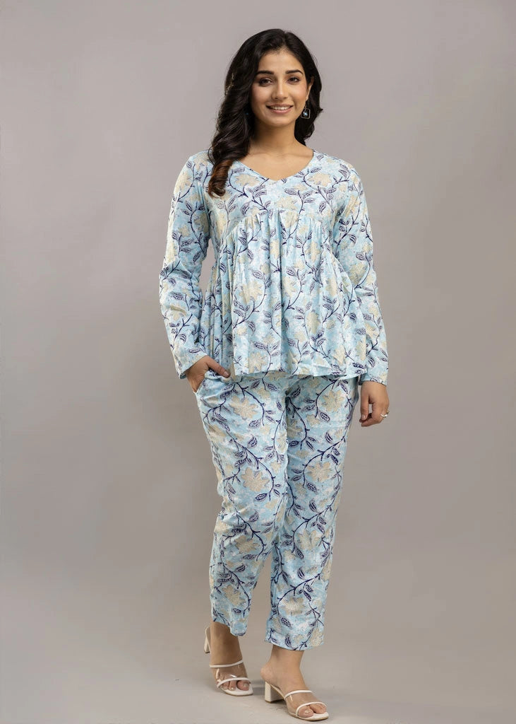 Women’s pastel blue leafy print co-ord set in soft rayon, featuring a gathered flowy top with a gentle V-neckline and full sleeves, paired with relaxed-fit pants with pockets — a blend of comfort and elegance for everyday wear.