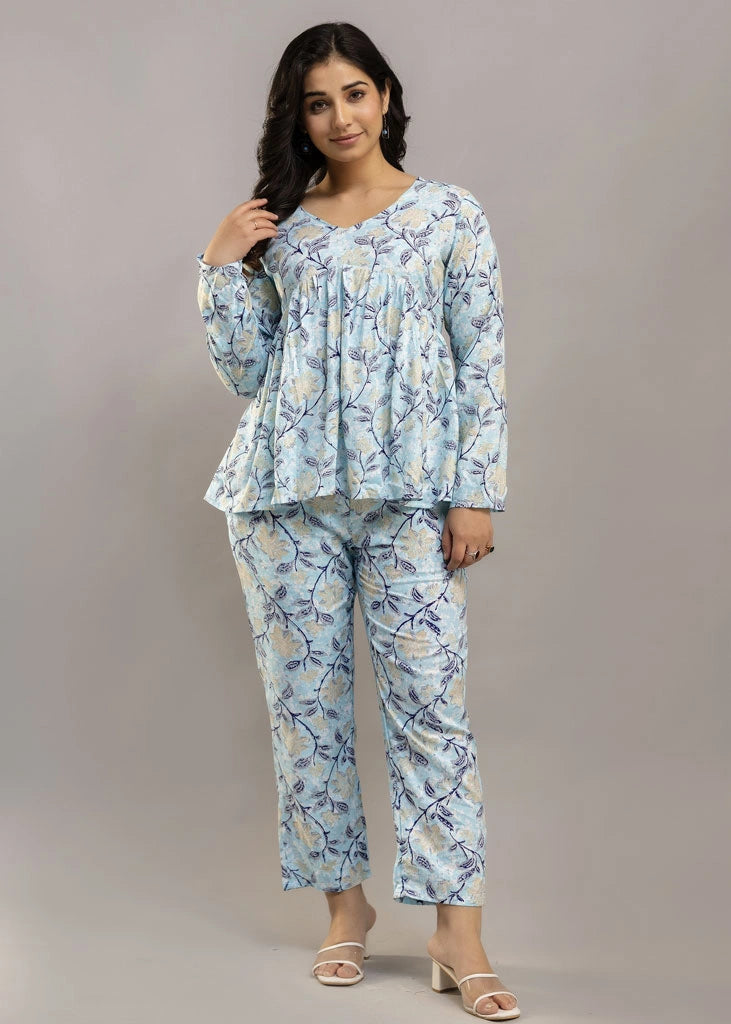 Women’s pastel blue leafy print co-ord set in soft rayon, featuring a gathered flowy top with a gentle V-neckline and full sleeves, paired with relaxed-fit pants with pockets — a blend of comfort and elegance for everyday wear.