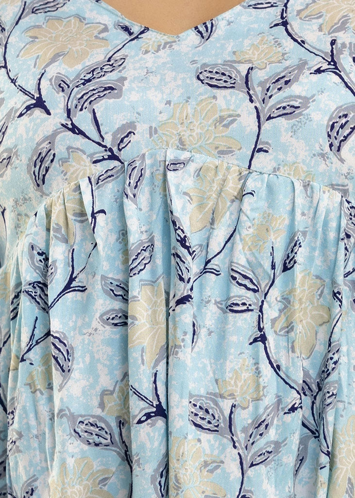 Women’s pastel blue leafy print co-ord set in soft rayon, featuring a gathered flowy top with a gentle V-neckline and full sleeves, paired with relaxed-fit pants with pockets — a blend of comfort and elegance for everyday wear.