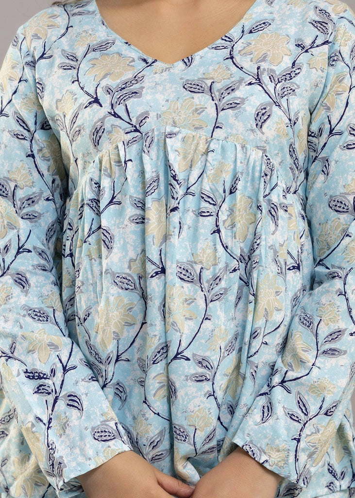 Women’s pastel blue leafy print co-ord set in soft rayon, featuring a gathered flowy top with a gentle V-neckline and full sleeves, paired with relaxed-fit pants with pockets — a blend of comfort and elegance for everyday wear.