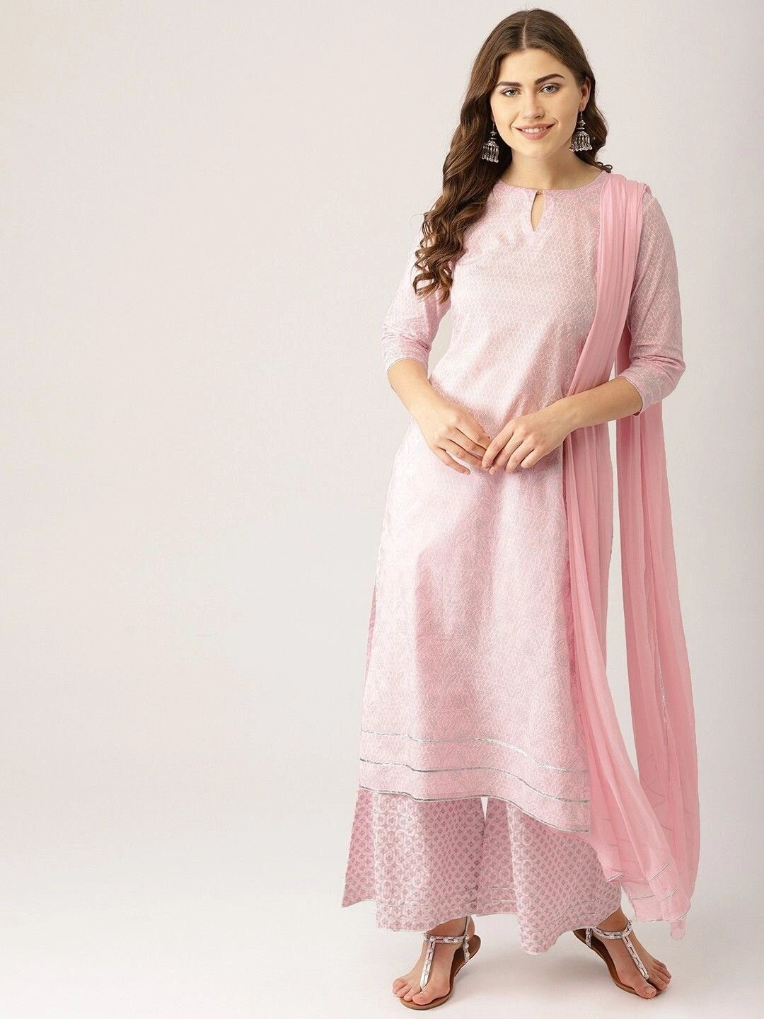 Women’s light pink ethnic motifs printed kurta set with silver gotta patti work, featuring a straight-fit kurta with keyhole neckline, three-quarter sleeves, flared palazzo pants, and a matching sheer dupatta.