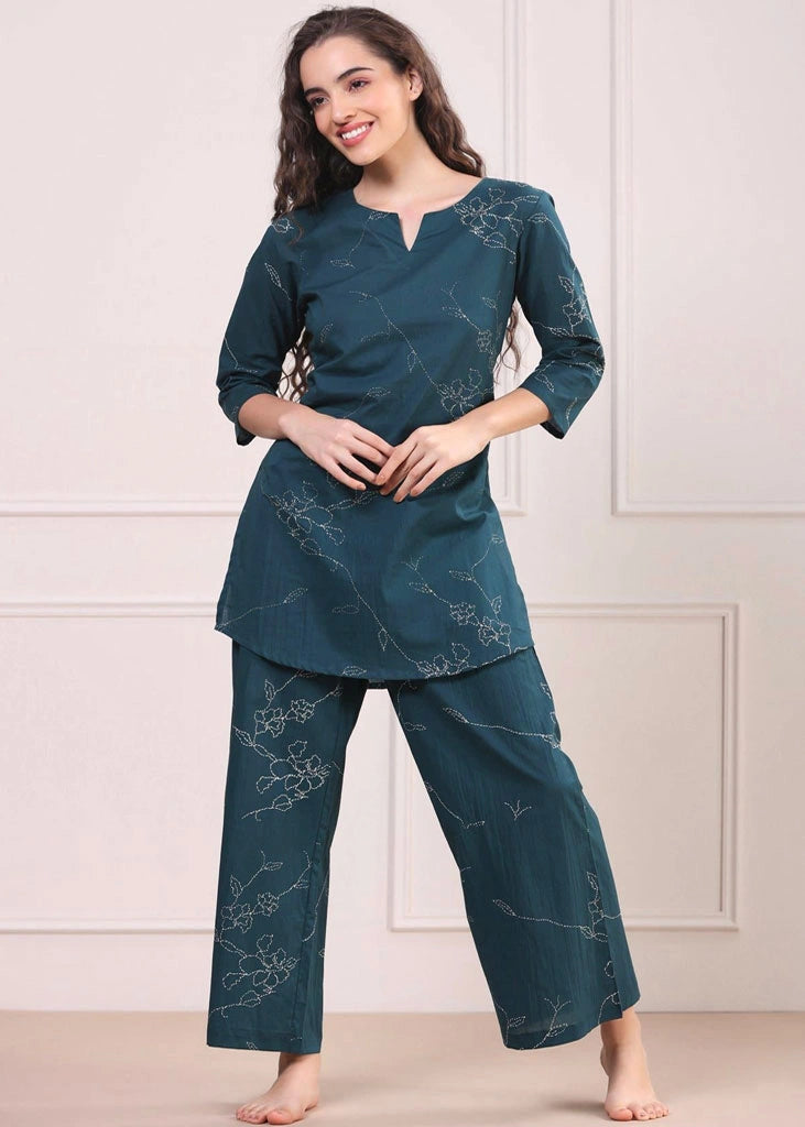 Women’s Green floral printed co-ord set in pure cotton, featuring a round-neck tunic with three-quarter sleeves and matching printed trousers with an elasticated slip-on waistband — lightweight, breathable, and perfect for casual wear.