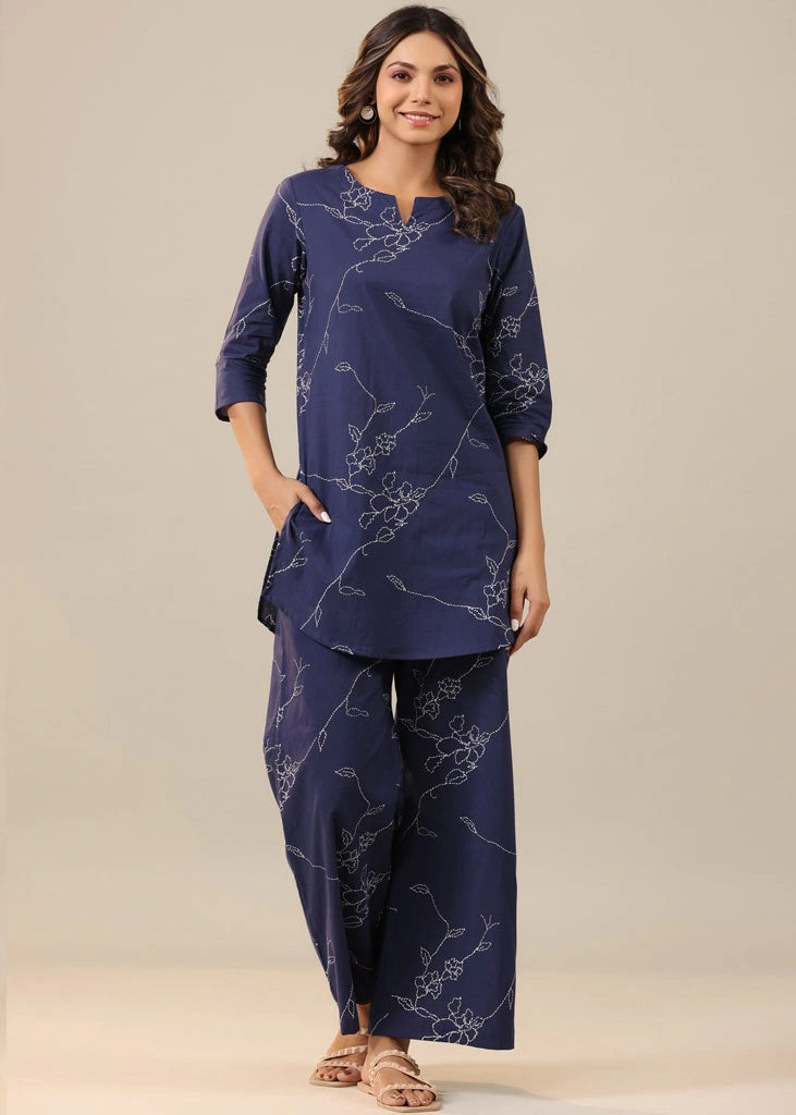 Women’s blue floral printed co-ord set in pure cotton, featuring a round-neck tunic with three-quarter sleeves and matching printed trousers with an elasticated slip-on waistband — lightweight, breathable, and perfect for casual wear.