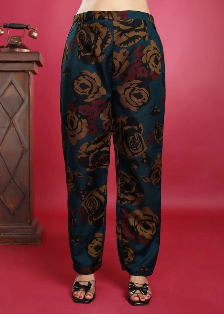 Women’s blue viscose rayon co-ord set featuring a collared top with 3/4 sleeves and vibrant yellow and red floral embroidery, paired with matching pants — a breezy, elegant outfit for casual or semi-formal wear.
