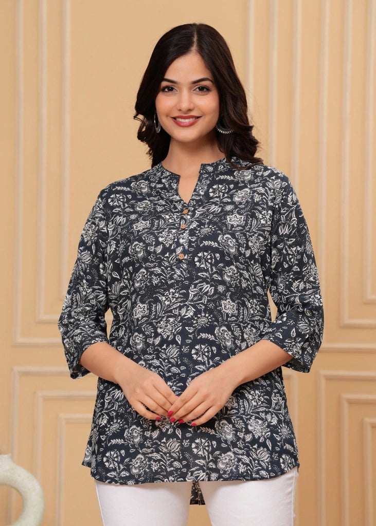 Women's floral black cotton straight tunic top with three-quarter sleeves, featuring breathable fabric and a flattering silhouette ideal for casual, work, or semi-formal occasions.