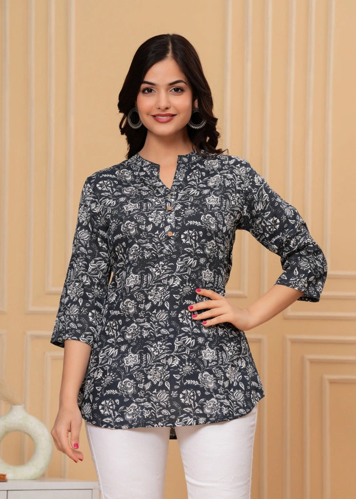 Women's floral black cotton straight tunic top with three-quarter sleeves, featuring breathable fabric and a flattering silhouette ideal for casual, work, or semi-formal occasions.