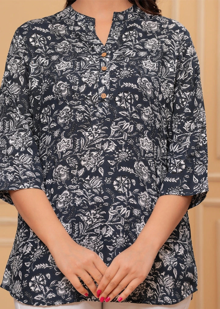 Women's floral black cotton straight tunic top with three-quarter sleeves, featuring breathable fabric and a flattering silhouette ideal for casual, work, or semi-formal occasions.