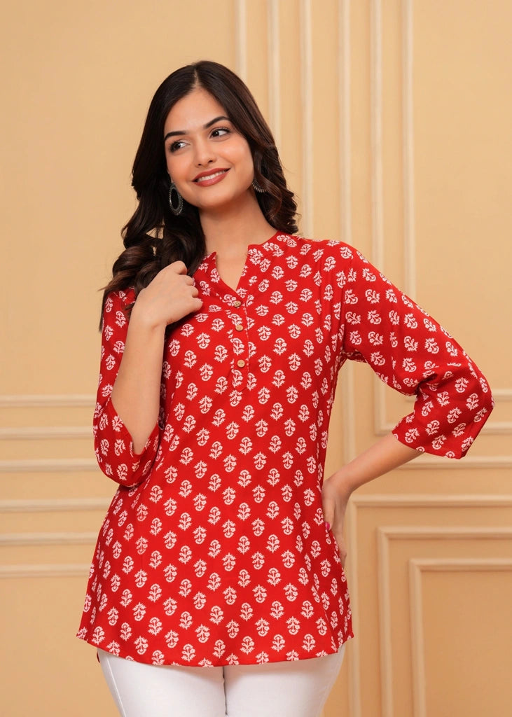 Red printed cotton straight tunic top for women with three-quarter sleeves, featuring breathable fabric and a flattering silhouette perfect for casual, work, or semi-formal wear.
