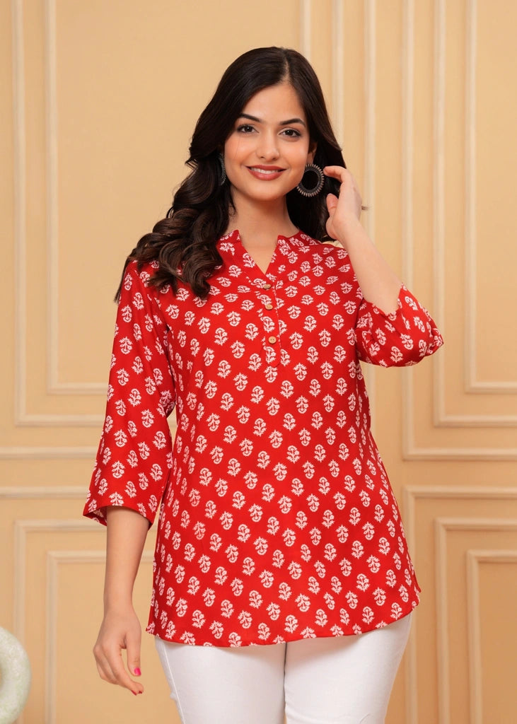Red printed cotton straight tunic top for women with three-quarter sleeves, featuring breathable fabric and a flattering silhouette perfect for casual, work, or semi-formal wear.